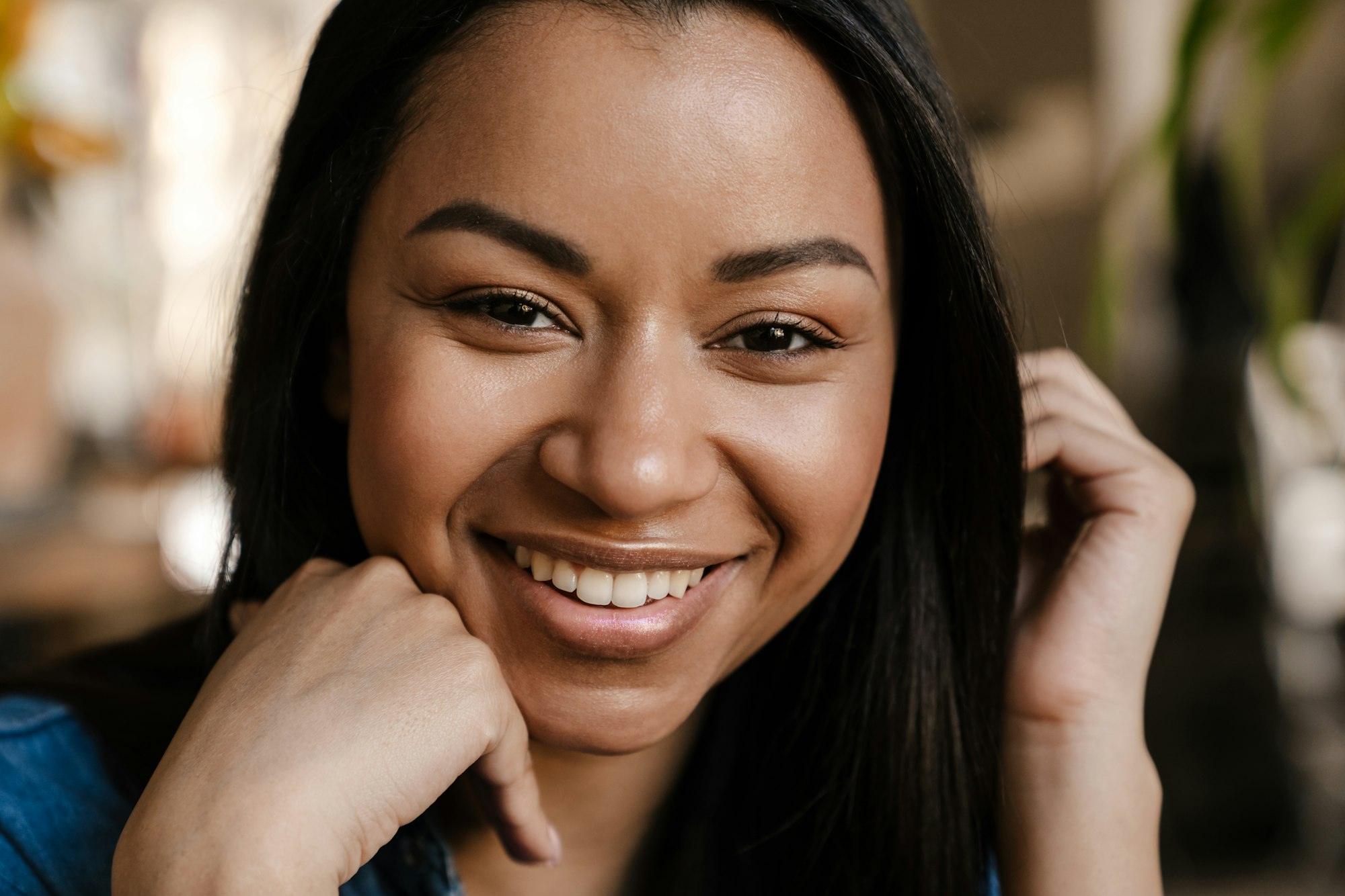 Young woman smiling at camera, featuring the benefits of advanced composite fillings at Encinitas Dental Art.